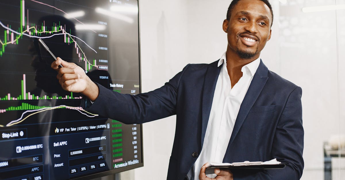 Businessman presents financial data using graphs, showcasing technology and analysis in a corporate environment.